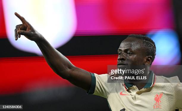 Liverpool's Senegalese striker Sadio Mane celebrates scoring the team's second goal during the English Premier League football match between Aston...