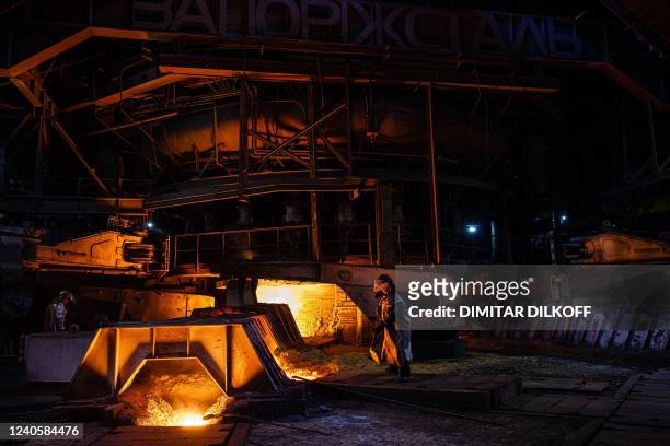 Steel worker works on the maintenance of the blast furnace at Zaporizhstal, Ukraine's third-biggest metals plan, in Zaporizhzhia on May 10 amid the...