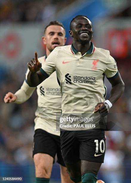 Liverpool's Senegalese striker Sadio Mane celebrates scoring the team's second goal during the English Premier League football match between Aston...