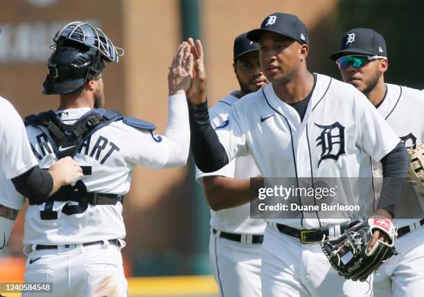 Jonathan Schoop of the Detroit Tigers, who hit a home run during the sixth inning, celebrates with catcher Tucker Barnhart after a 6-0 twin over the...