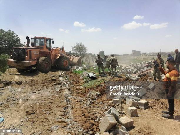 Ruins of demolished house are seen as Kirkuk Municipality teams demolish buildings in areas where animals are raised under unfavorable conditions...