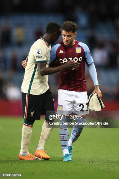 Sadio Mane of Liverpool and Philippe Coutino of Villa during the Premier League match between Aston Villa and Liverpool at Villa Park on May 10, 2022...