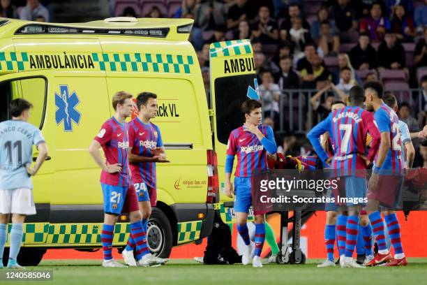 Ronald Araujo of FC Barcelona is leaving the pitch injured in an ambulance during the La Liga Santander match between FC Barcelona v Celta de Vigo at...