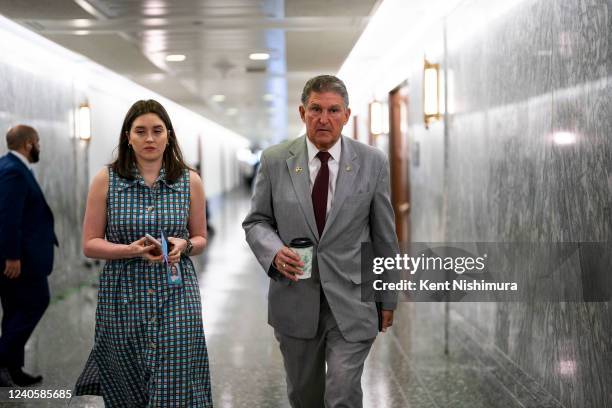 Sen. Joe Manchin walks through a hallway in a Senate Office Building on Capitol Hill on Tuesday, May 10, 2022 in Washington, DC.