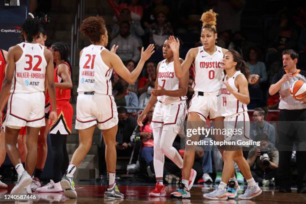 Washington Mystics high five during the game against the Las Vegas Aces on May 10, 2022 at Capital One Arena in Washington, DC. NOTE TO USER: User...