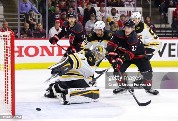 Jaccob Slavin of the Carolina Hurricanes scores a goal past goaltender Jeremy Swayman of the Boston Bruins during the first period in Game Five of...