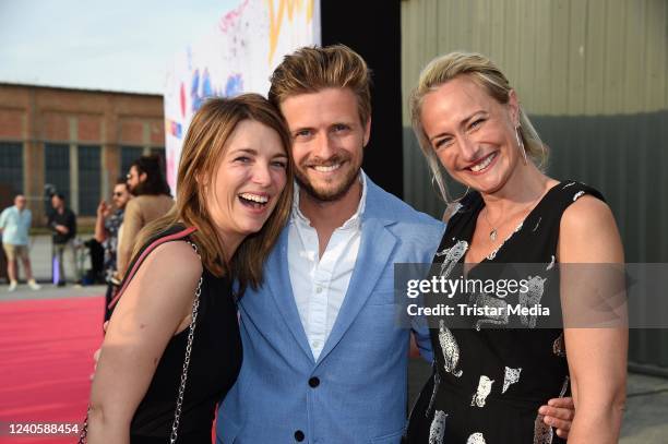 And GERMANY Iris Mareike Steen, Joern Schloenvoigt and Eva Mona Rodekirchen during the GZSZ 30th anniversary party at Kolle-Kiez on May 10 and 2022...