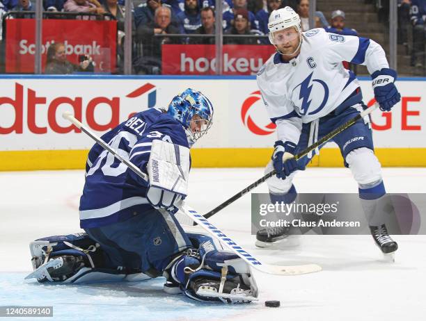 Jack Campbell of the Toronto Maple Leafs makes a save as Steven Stamkos of the Tampa Bay Lightning looks for a rebound during Game Five of the First...