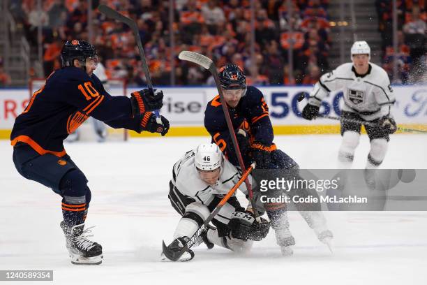 Josh Archibald of the Edmonton Oilers battles against Blake Lizotte of the Los Angeles Kings during the first period in Game Five of the First Round...