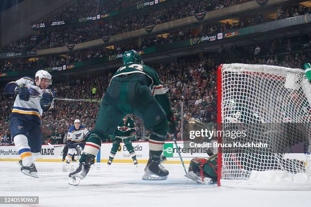 Vladimir Tarasenko of the St. Louis Blues scores a goal with Jordan Greenway and Marc-Andre Fleury of the Minnesota Wild defending in Game Five of...