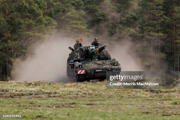 Soldiers of the Bundeswehr, the German armed forces, participate with the Panzerhaubitze 2000 - the Pzh 2000 self-propelled howitzer in the Wettiner...