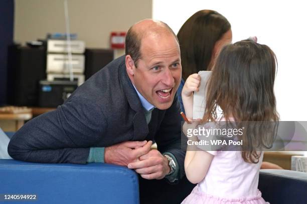 The Duke of Cambridge speaks to Olivia Wilson, two, during a visit to the Wheatley Group in Glasgow, to hear about the challenges of homelessness in...