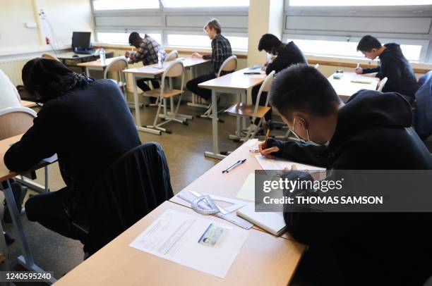 Pupils get ready before a test as part of the baccalaureat exams at the Lycee technique Diderot in Paris, on May 11, 2022. Some 520,000 high school...