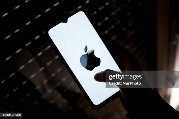In this photo illustration an Apple logo seen displayed on a smartphone screen in Athens, Greece on May 11, 2022.