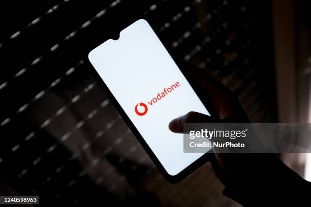 In this photo illustration a Vodafone logo seen displayed on a smartphone screen in Athens, Greece on May 11, 2022.