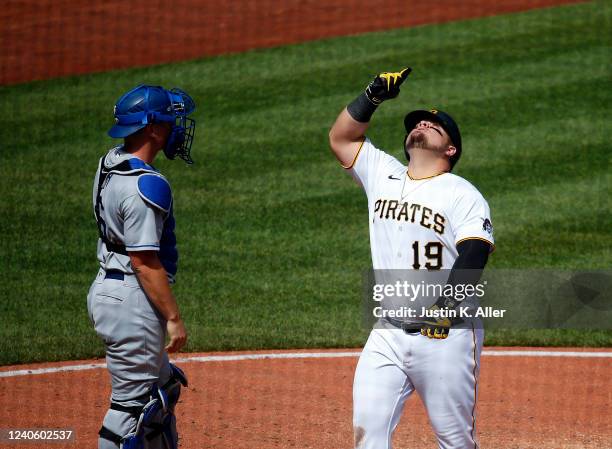 Daniel Vogelbach of the Pittsburgh Pirates reacts after hitting a solo home run in the seventh inning against the Los Angeles Dodgers during the game...