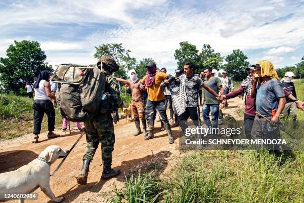 Coca growers block soldiers with the order of destroying plantations of the cocaine-yielding plant, in Caño Indio, Catatumbo, municipality of Tibú,...