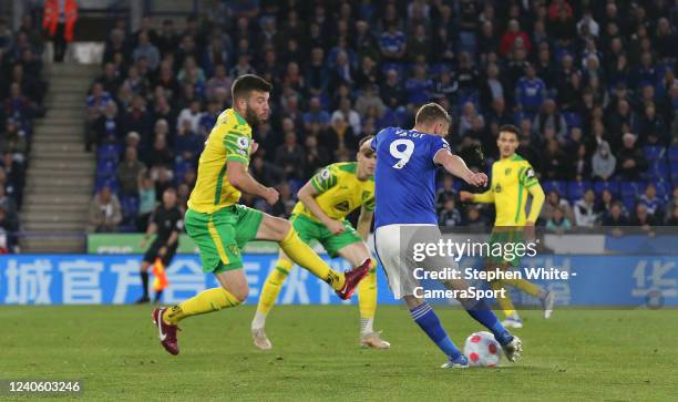 Leicester City's Jamie Vardy scores the opening goal his shot deflected by Norwich City's Grant Hanley during the Premier League match between...