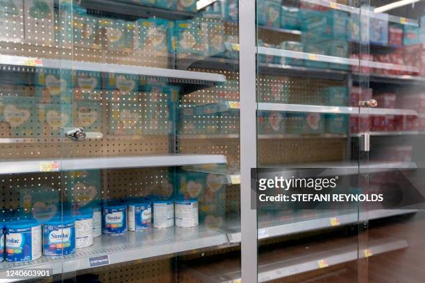 Grocery store shelves where baby formula is typically stocked are locked and nearly empty in Washington, DC, on May 11, 2022. It's a parent's worst...