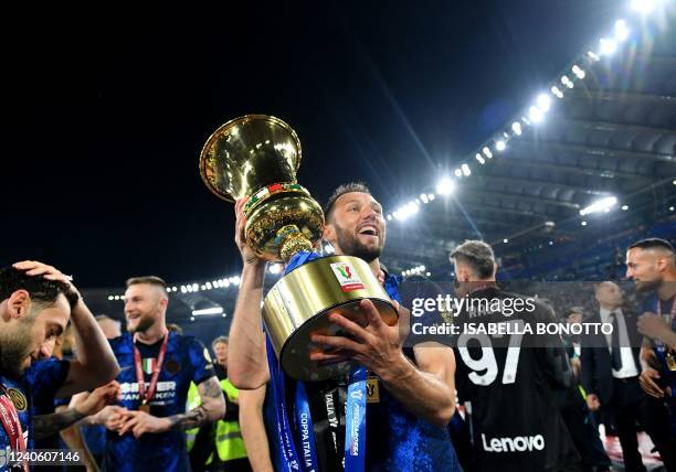 Inter Milan's Dutch defender Stefan de Vrij celebrates with the winner's trophy after Inter won the Italian Cup final football match between Juventus...