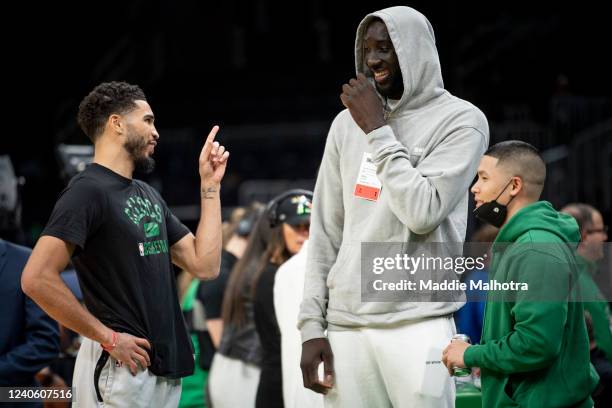 Jayson Tatum of the Boston Celtics reacts with Tacko Fall before Game Five of the Eastern Conference Semifinals against the Milwaukee Bucks at TD...