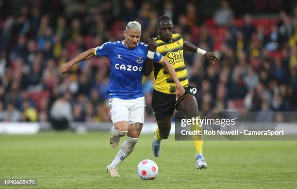 Everton's Richarlison and Watford's Moussa Sissoko during the Premier League match between Watford and Everton at Vicarage Road on May 11, 2022 in...