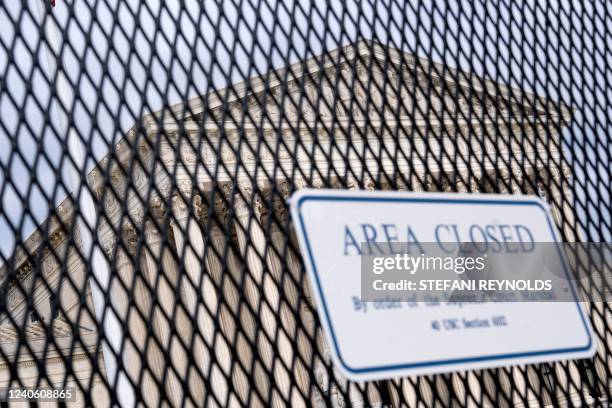 Supreme Court is seen through a fence with a "Closed Area" sign in Washington, DC, on May 11, 2022. - Senate Democrats today were unsuccessful in...