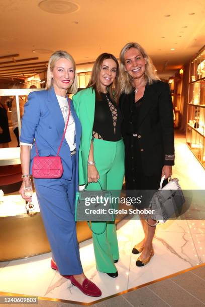 Monika Gruber, Sylwia Klose, wife of soccer player Miroslav Klose, Saskia Greipl during the Oberpollinger fashion floors grand opening at...