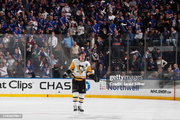 Evgeni Malkin of the Pittsburgh Penguins looks on against the New York Rangers in Game Five of the First Round of the 2022 Stanley Cup Playoffs at...