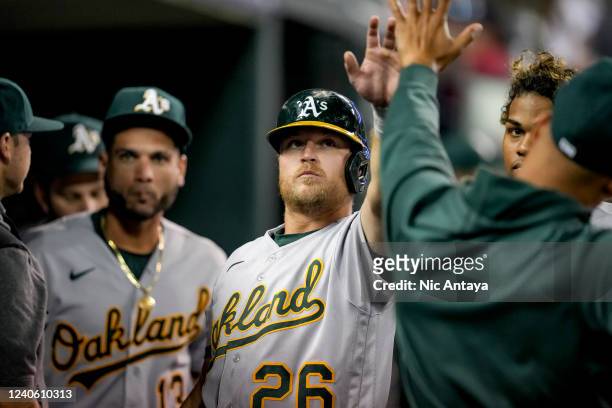Sheldon Neuse of the Oakland Athletics celebrates after scoring a run against the Detroit Tigers during the top of the ninth inning at Comerica Park...