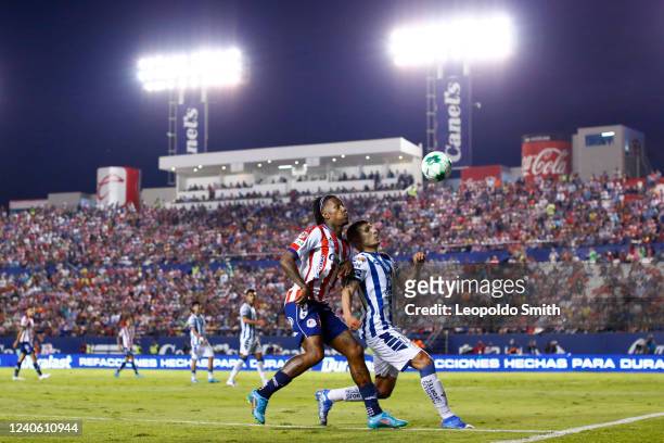 Abel Hernandez of Atletico San Luis competes for the ball with Miguel Tapias of Pachuca during the quarterfinals first leg match between Atletico San...