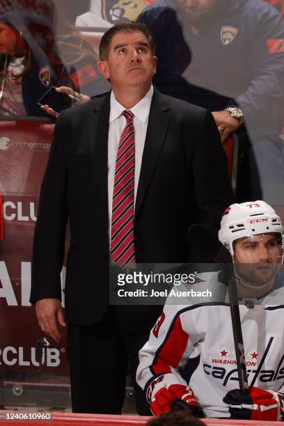 Head coach Peter Laviolette of the Washington Capitals watches a replay of a goal in the third period against the Florida Panthers in Game Five of...