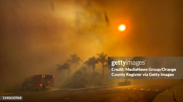 Laguna Niguel, CA Firefighters battle the Coastal Fire near the intersection of Vista Montemar and Coronado Pointe in Laguna Niguel, CA, on...