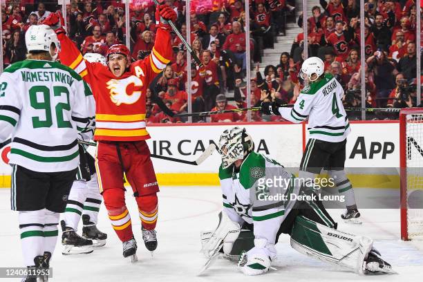Mikael Backlund of the Calgary Flames scores against Jake Oettinger of the Dallas Stars during the third period of Game Five of the First Round of...