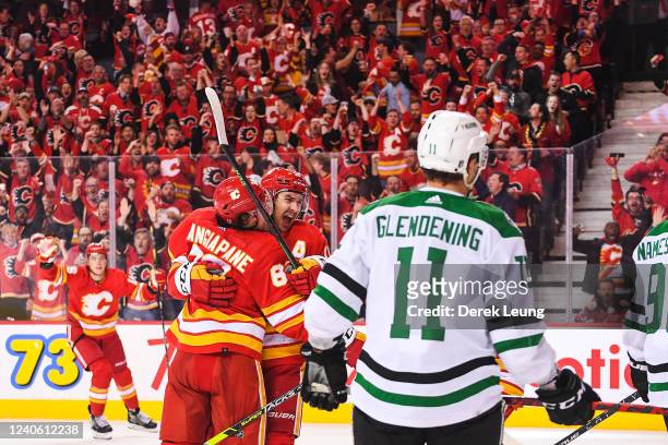 Mikael Backlund of the Calgary Flames celebrates after scoring against the Dallas Stars during the third period of Game Five of the First Round of...