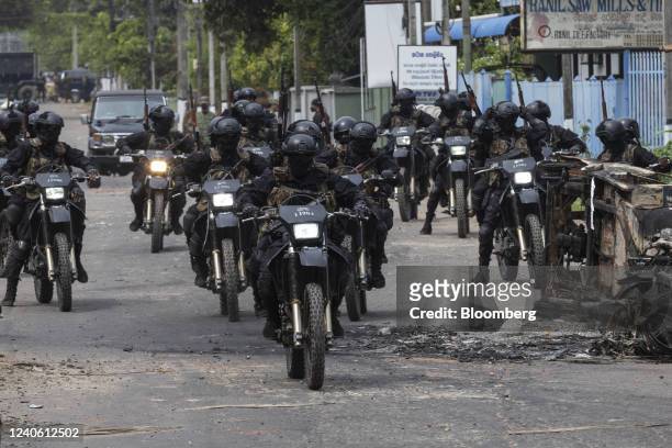 Sri Lankan Army Commando Regiment officers on motorcycles patrol the street during a curfew in Negombo, Sri Lanka, on Wednesday, May 11, 2022....