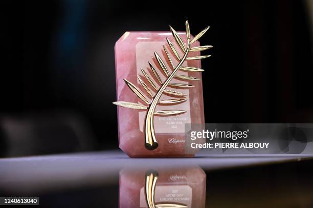 The Palme d'Or trophy is pictured at Chopard Jewellery House on May 10, 2022 in Meyrin near Geneva ahead of the 75th Cannes Film Festival starting...