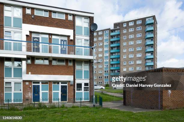 High rise tower block of flats overlooks more council housing with makeshift goal posts spray painted on a nearby wall in Lincoln Green, an area with...
