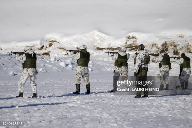 This picture taken on March 9, 2022 shows reservists of the Karelia Brigade at a shooting practice during the Etelä-Karjala 22 local defence exercise...