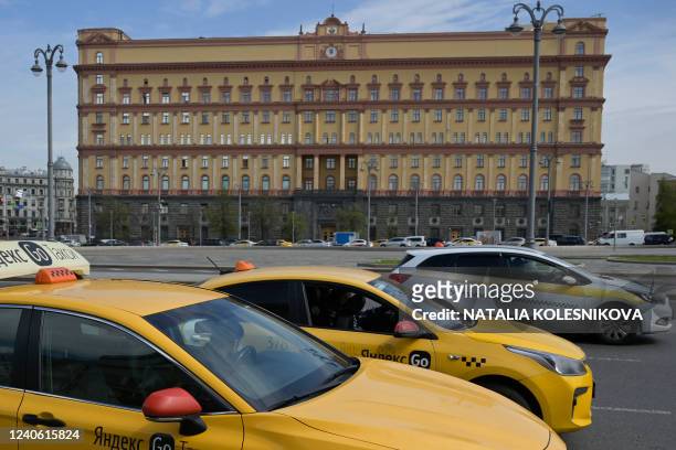 Taxis move past the headquarters of Russia's Federal Security Services in central Moscow on May 12, 2022. Russia's government has put forward a law...