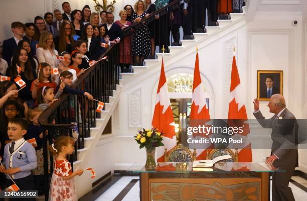 Prince Charles, Prince of Wales greets people as he visits Canada House in London, Britain May 12, 2022. REUTERS/Hannah McKay