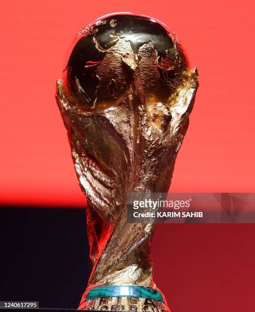 The FIFA World Cup trophy is on display during an event at Dubais Coca-Cola arena in the United Arab Emirates on May 12, 2022. - Qatar's FIFA World...