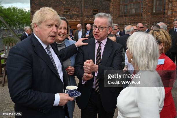 Britain's Prime Minister Boris Johnson , Britain's International Trade Secretary Anne-Marie Trevelyan , Britain's Housing Secretary Michael Gove and...