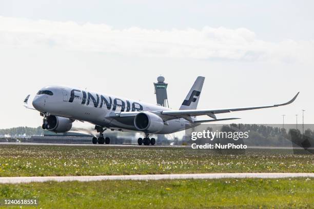 Finnair Airbus A350-900 aircraft as seen during rotation, take off and fly phase as the plane is departing from Amsterdam Schiphol Airport AMS EHAM....