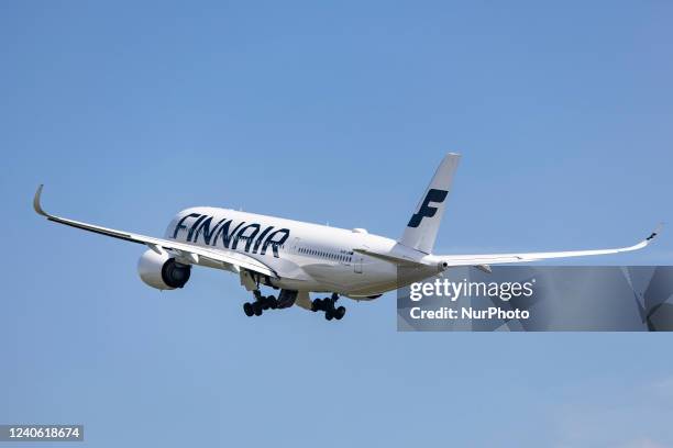 Finnair Airbus A350-900 aircraft as seen during rotation, take off and fly phase as the plane is departing from Amsterdam Schiphol Airport AMS EHAM....