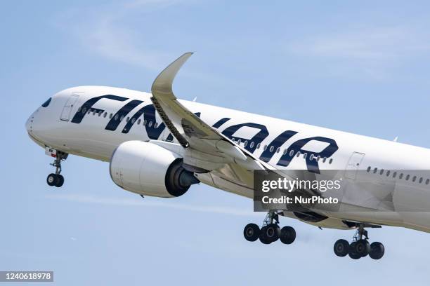 Finnair Airbus A350-900 aircraft as seen during rotation, take off and fly phase as the plane is departing from Amsterdam Schiphol Airport AMS EHAM....