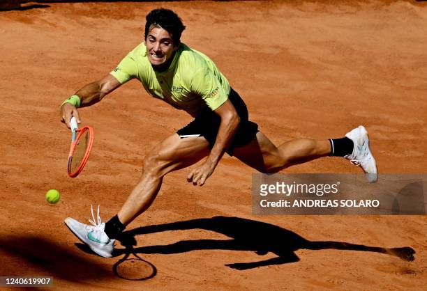 Chile's Christian Garin returns to Croatia's Marin Cilic during their third round match at the ATP Rome Open tennis tournament on May 12, 2022 at...