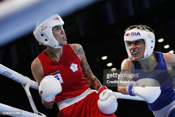 Lacramioara Perijoc of Romania competes with Hsiao-Wen Huang of Chinese Taipei during women's 54 kg match of the International Boxing Association...