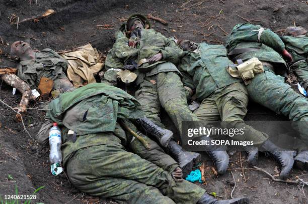 Bodies of eleven Russian soldiers in a mass grave in the Vil'khivka village. According to forensic doctors the bodies has been in decomposition...