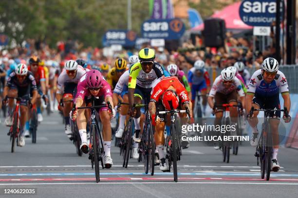Team Groupama-FDJ's French rider Arnaud Demare crosses the finish line to win ahead of Team Lotto's Australian rider Caleb Ewan the 6th stage of the...